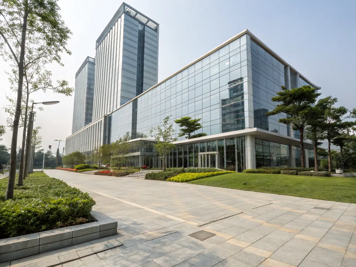 A commercial building with a spotless facade and clean surrounding pavement, demonstrating the effectiveness of commercial pressure washing.